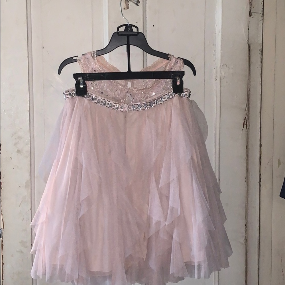 Pink cropped top and shirt with silver sparkles.